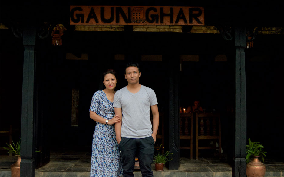 Couple taking picture infront of Gaun Ghar  at Bandipur